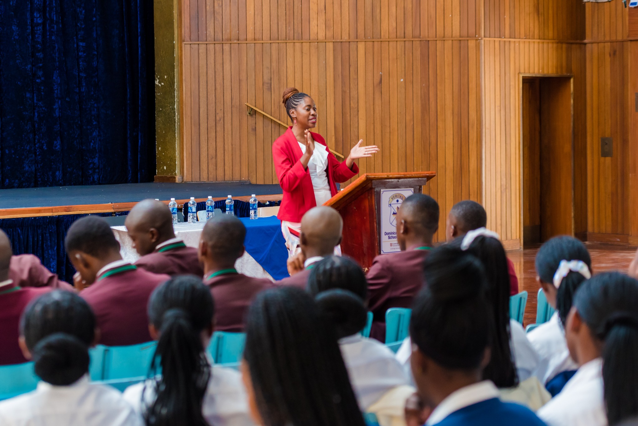 A teacher teaching children about savings and money